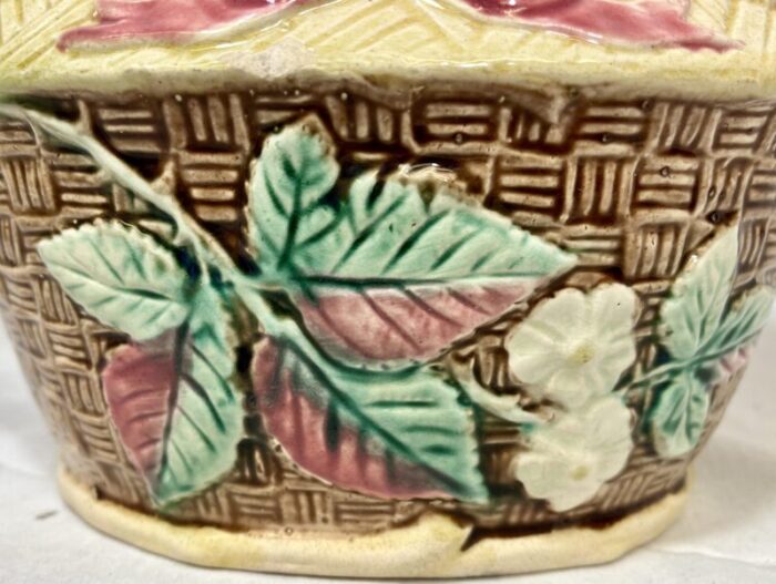 antique 19th century majolica basket planter with intricate weave pattern and delicate white flowers 2801