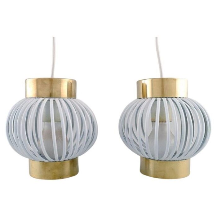 brass and white plastic pendants set of 2 1