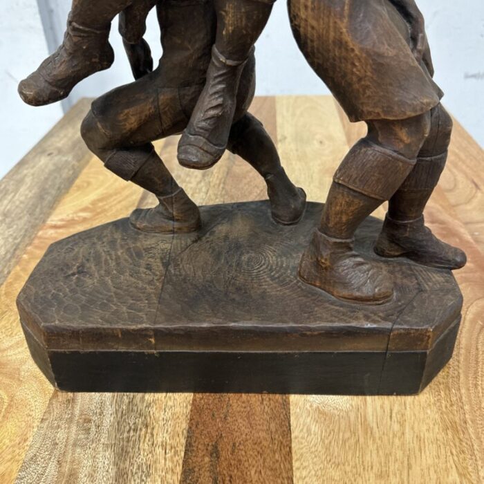 early 20th century carved wood figure sculpture of three rugby players 6760