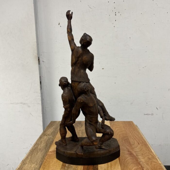 early 20th century carved wood figure sculpture of three rugby players 7769