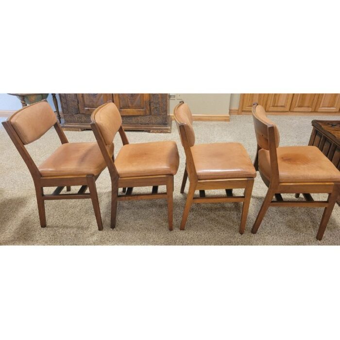 four vintage mcm teak and leather side chairs 3051