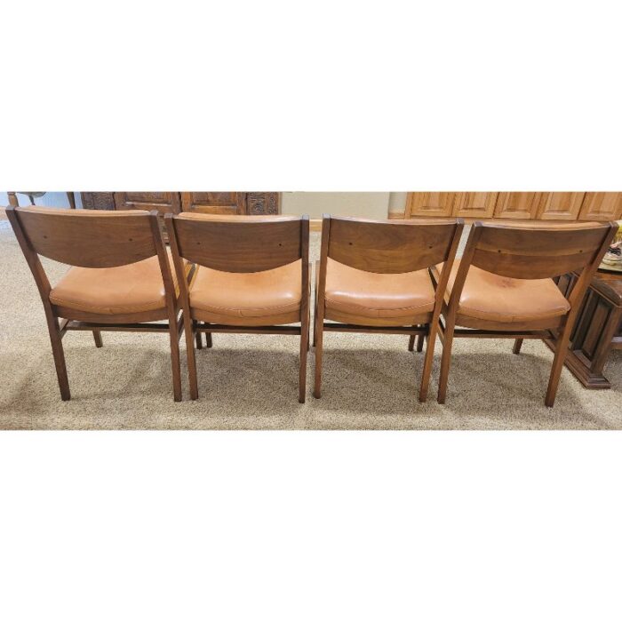 four vintage mcm teak and leather side chairs 4864