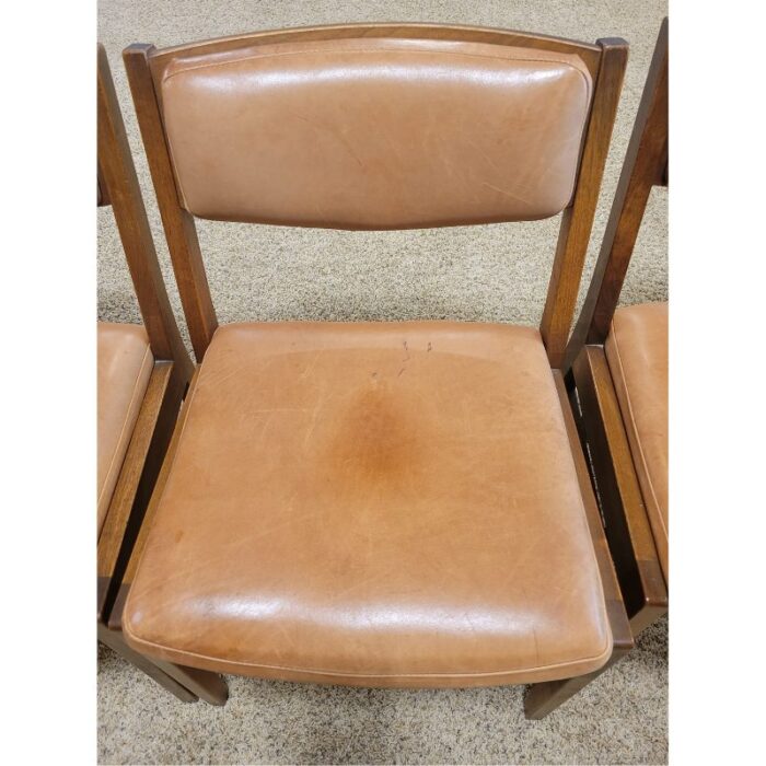 four vintage mcm teak and leather side chairs 6063