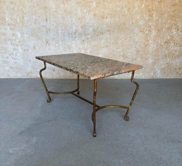 french gilt iron coffee table with pink and black marble top 1998