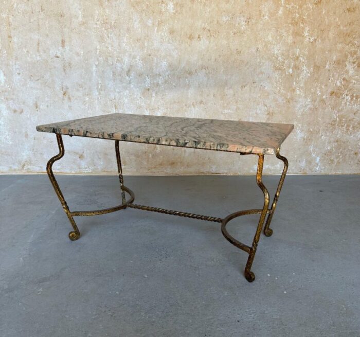 french gilt iron coffee table with pink and black marble top 7321