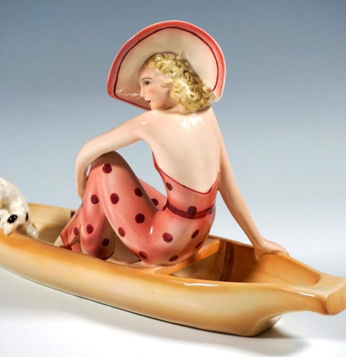 lady with fox terrier in boat from goldscheider vienna dakon 1935 2572