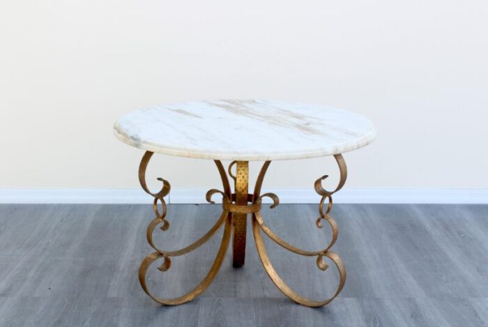 late 20th century hollywood regency metal gilt coffee table with italian marble top 1097