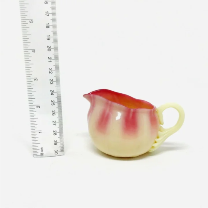 mid 20th century pairpoint ribbed glossy burmese glass creamer 0711