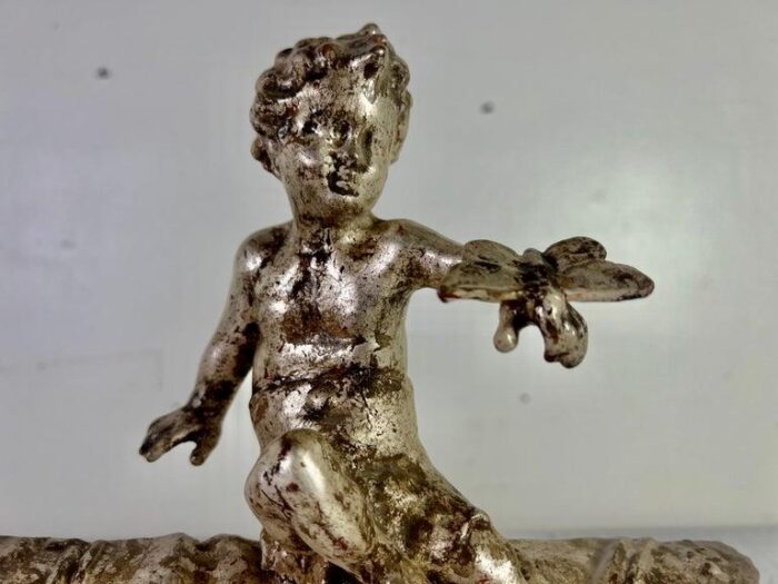 pair of french silvered gilt metal cherubs on lucite bases 2080