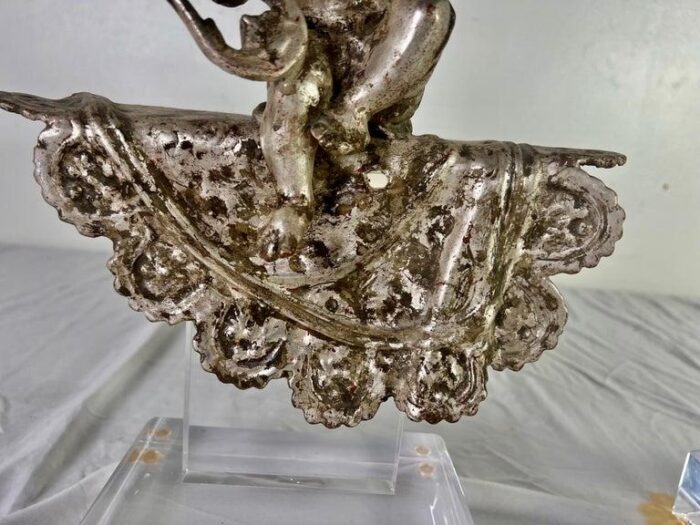 pair of french silvered gilt metal cherubs on lucite bases 2828