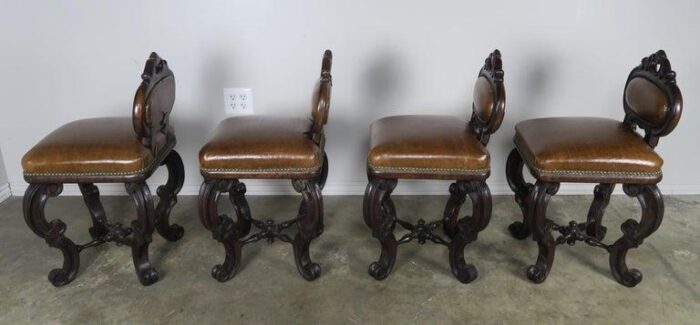 set of four french embossed leather stools circa 1900 1701