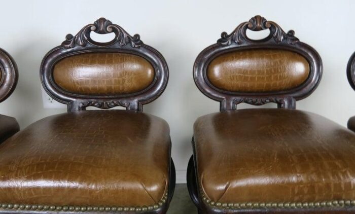 set of four french embossed leather stools circa 1900 4007