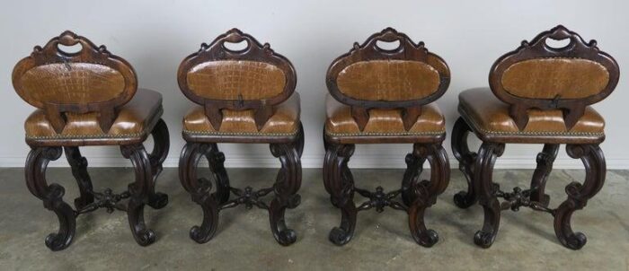 set of four french embossed leather stools circa 1900 4043