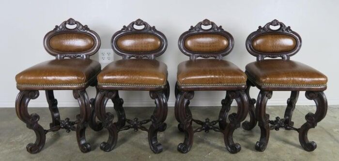 set of four french embossed leather stools circa 1900 8990