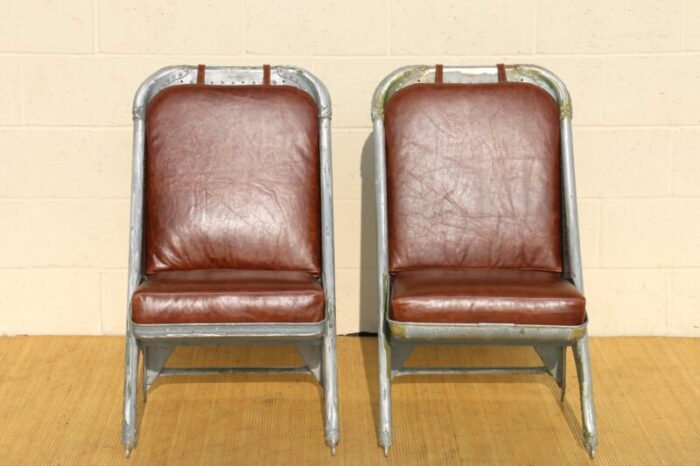 vintage leather airplane chairs with riveted aluminum and leather cushions 8587